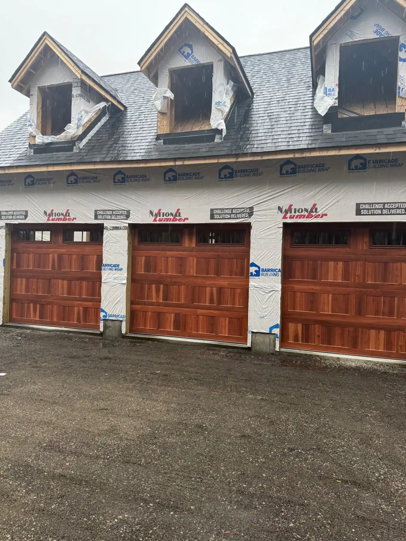 Wood garage doors installed during new home construction